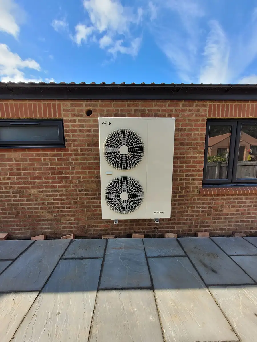 Air source heat pump on a porcelain path