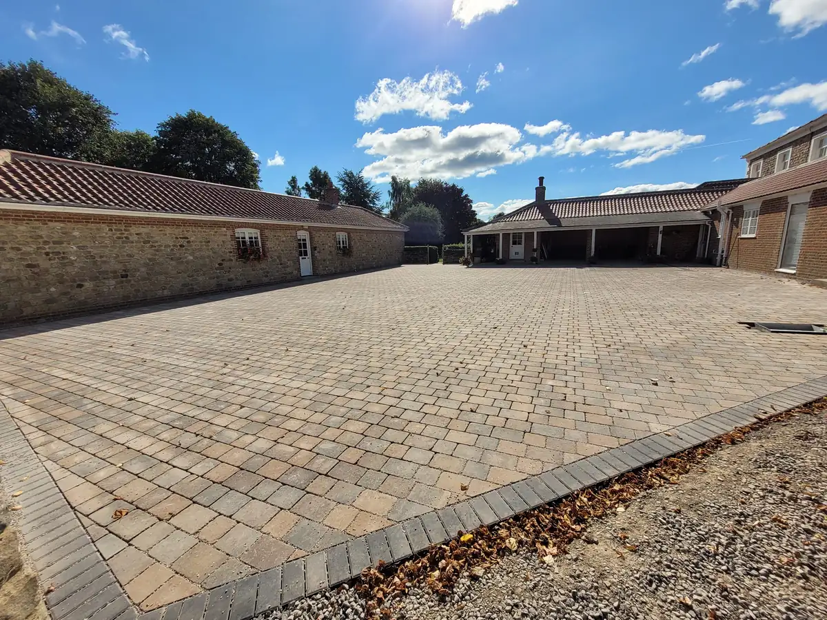 Block paved courtyard with brick edging