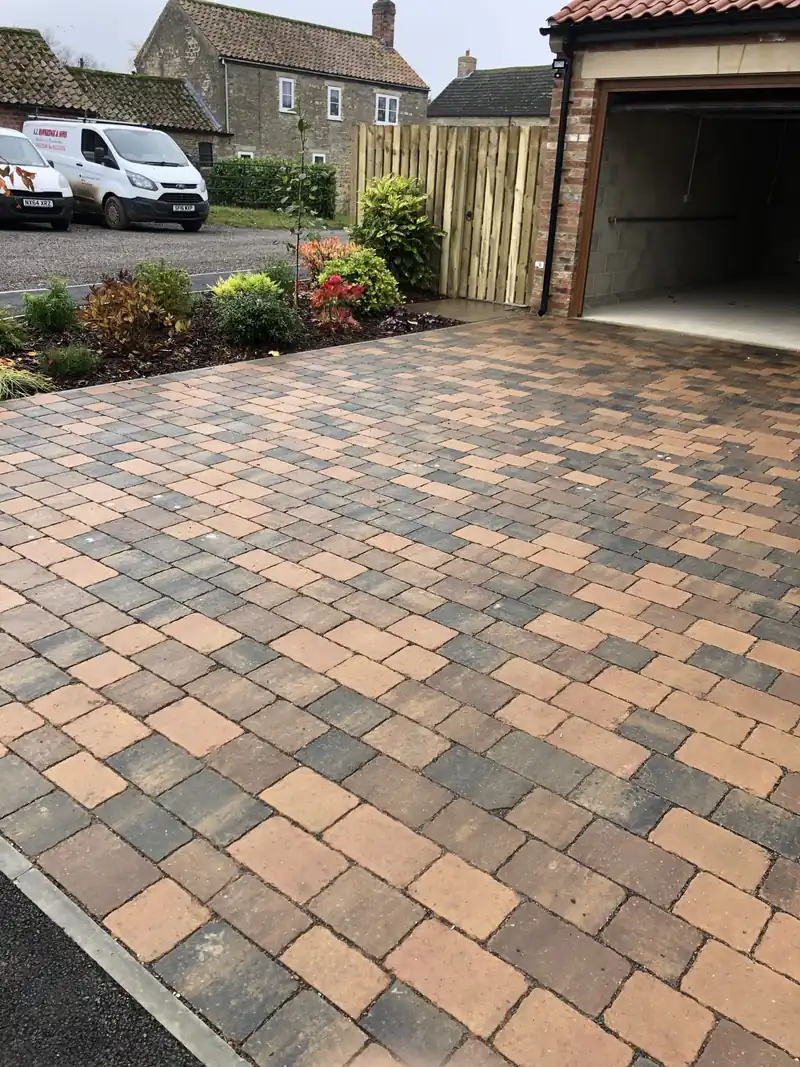 Block paved driveway with curved edge