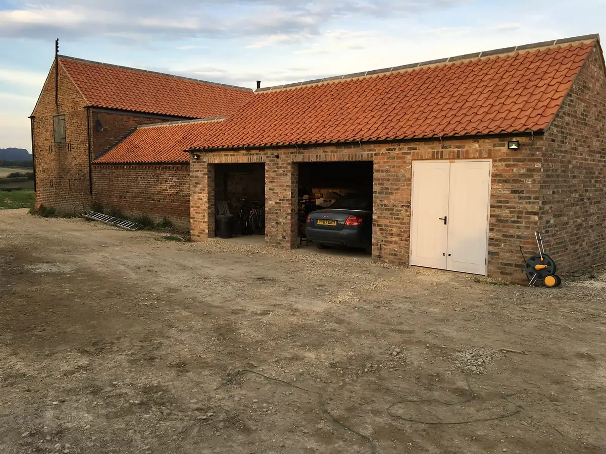 Brick and stone barn with cart openings