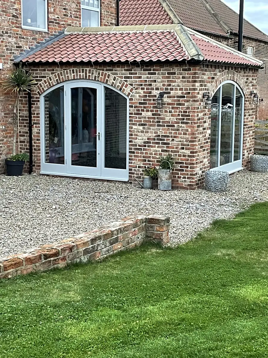 Brick orangery with arched windows