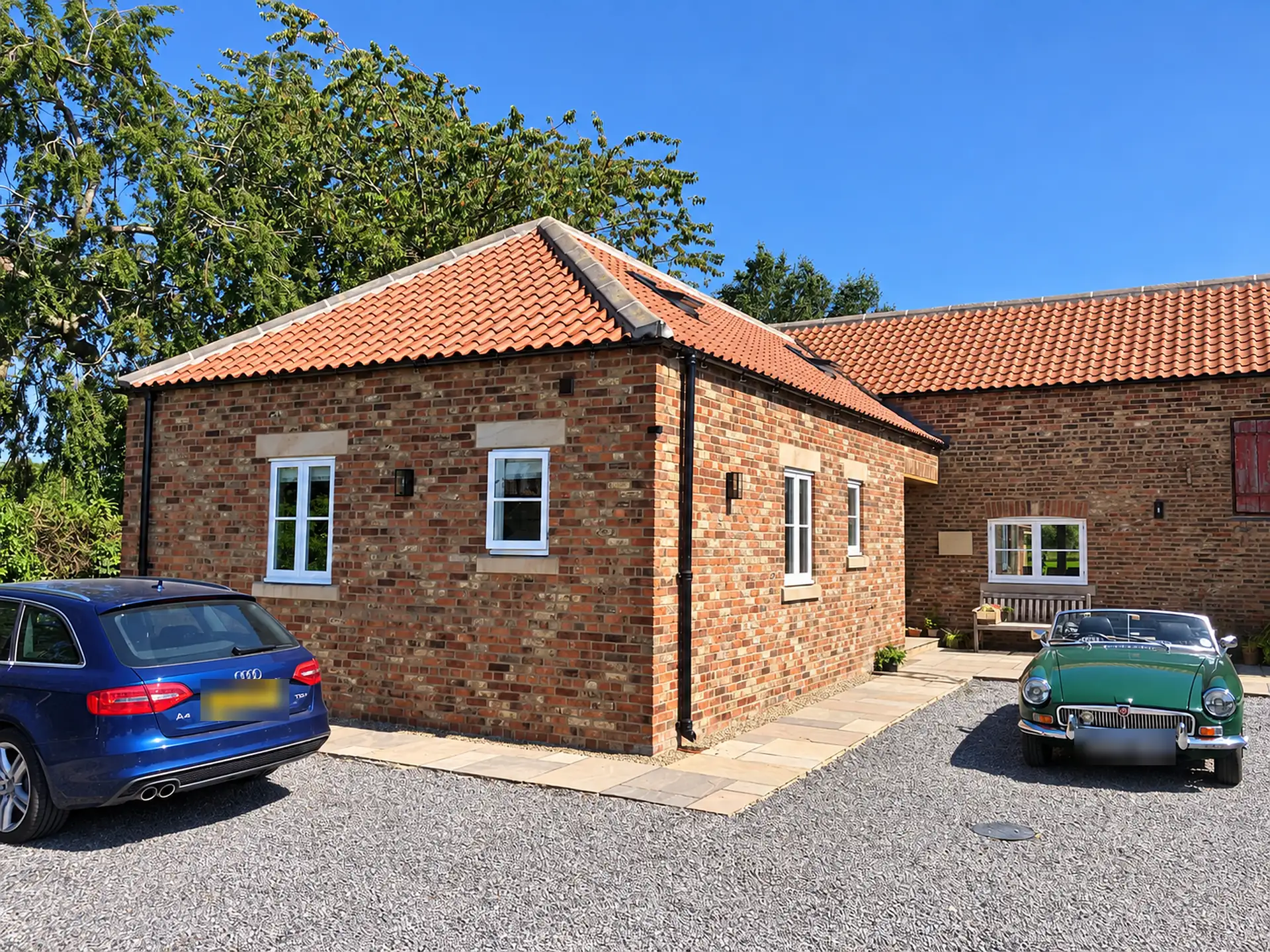 Converted brick barn with pantile roof