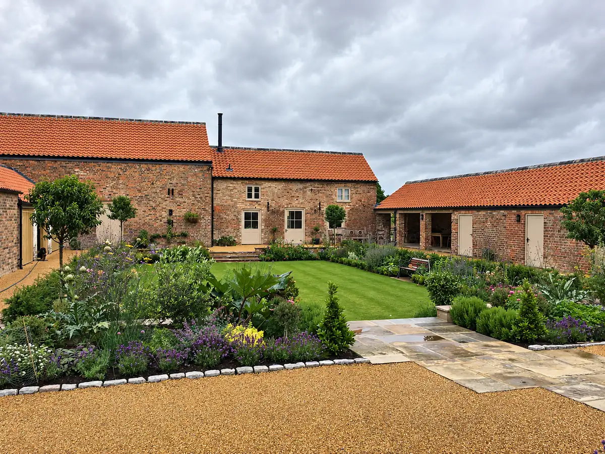 Converted farm buildings around a courtyard garden