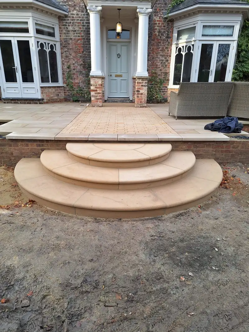 Curved sandstone steps to a Georgian house