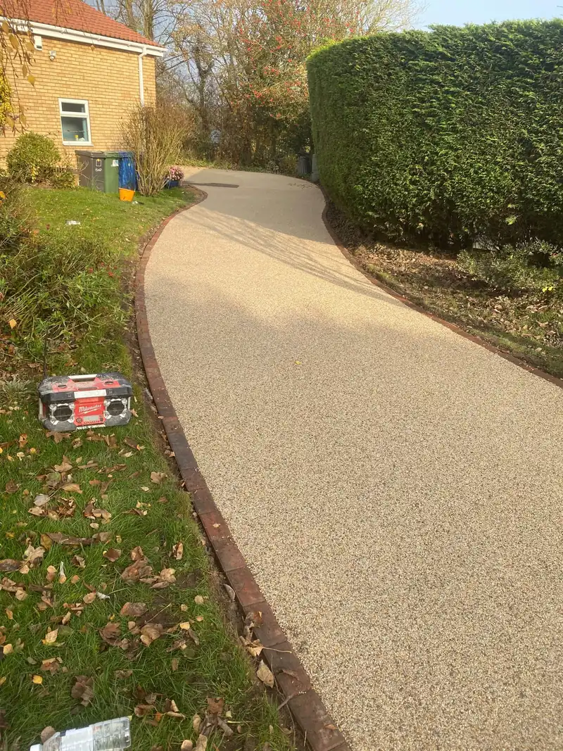 Curving resin path through a garden
