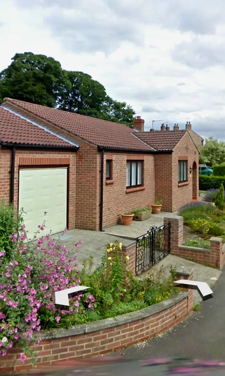 Front of the original bungalow with its garage
