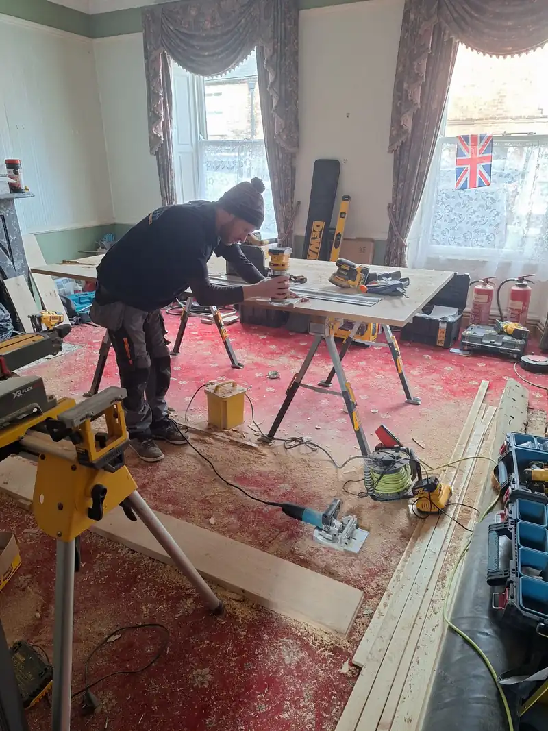 Joiner cutting boards in a room under renovation
