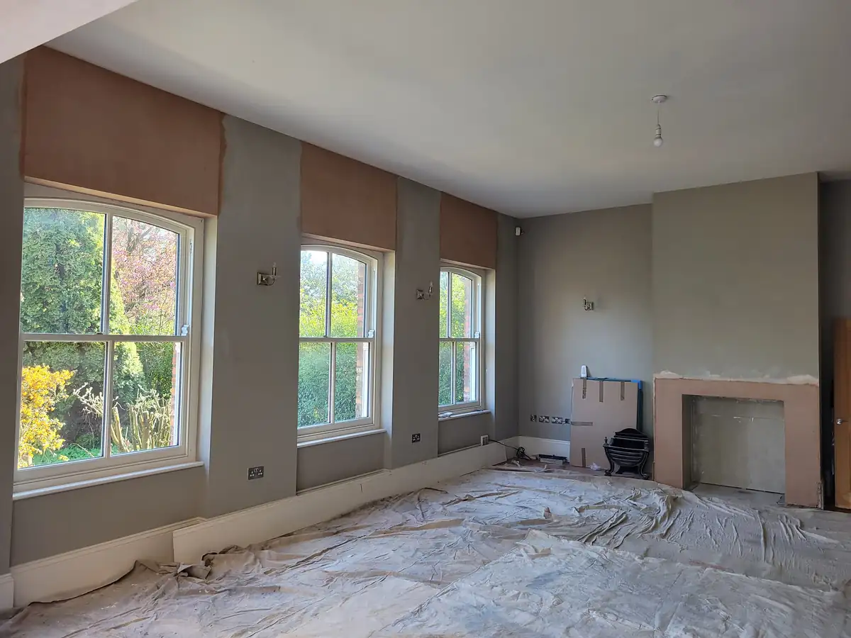 Living room with sash windows ready for decorating