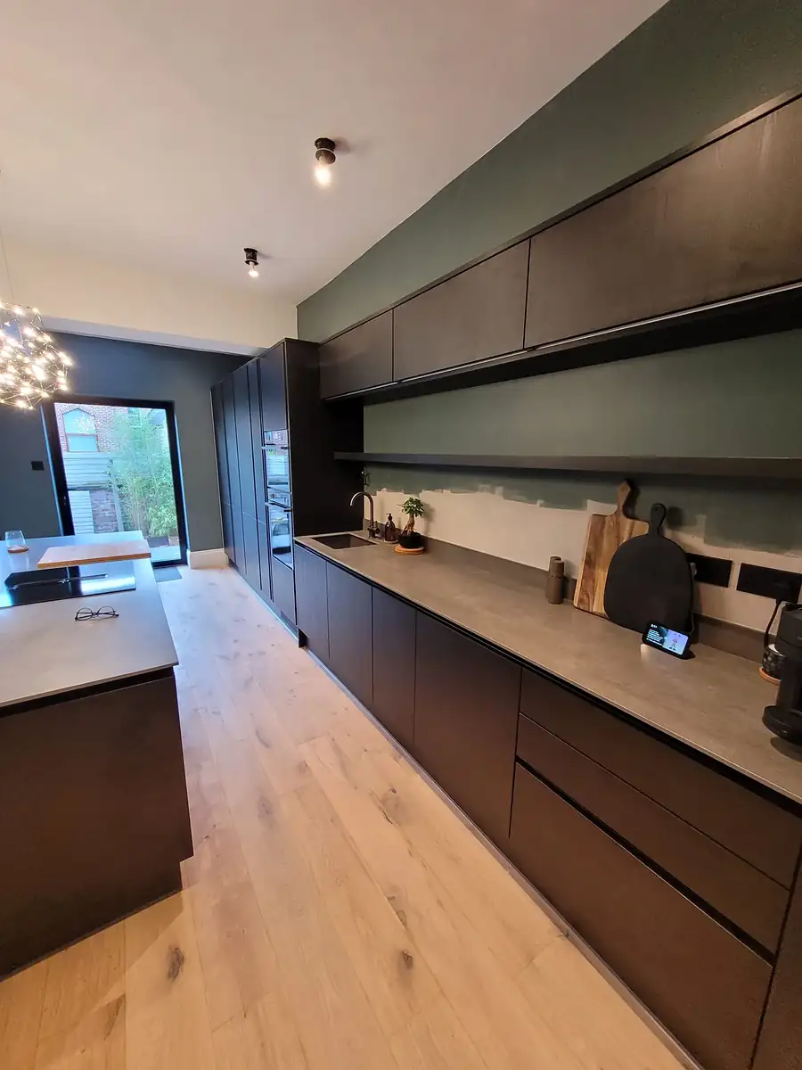 Long kitchen with an oak floor