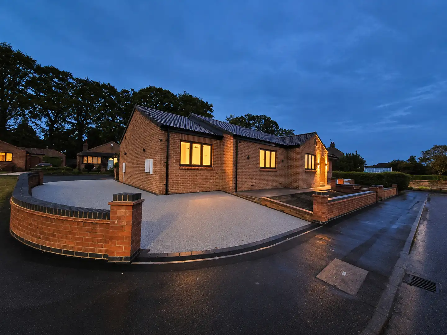 New brick bungalow at Mallorie Court in Ripon lit up at dusk