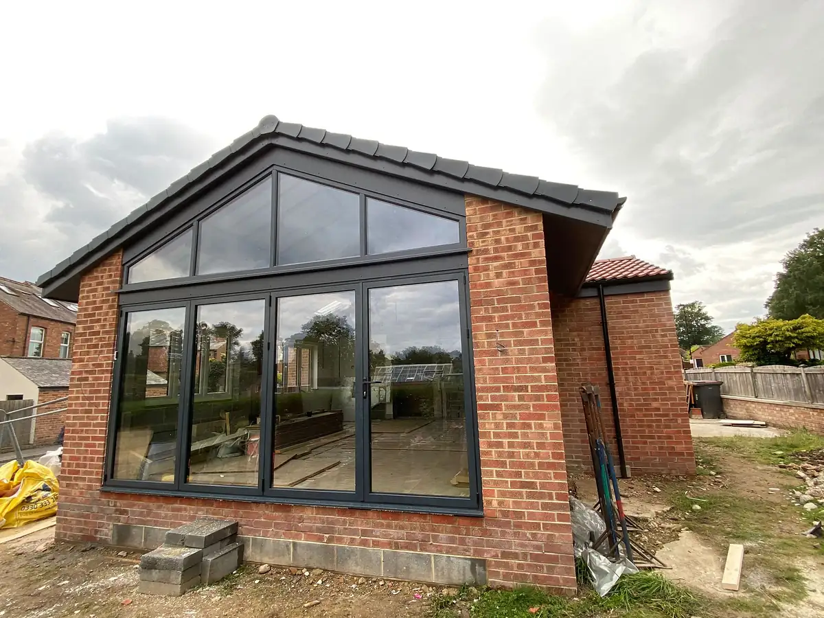 New glazed gable with brick below