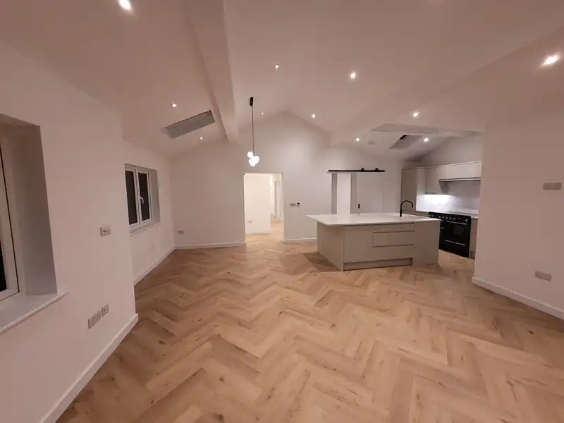 Open plan kitchen with herringbone floor at Mallorie Court