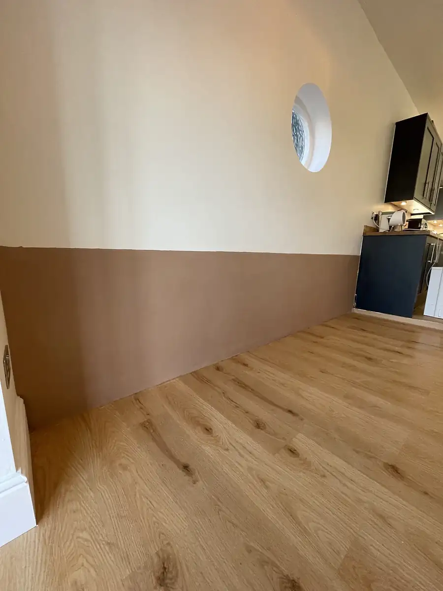 Painted room with oak floor after plastering
