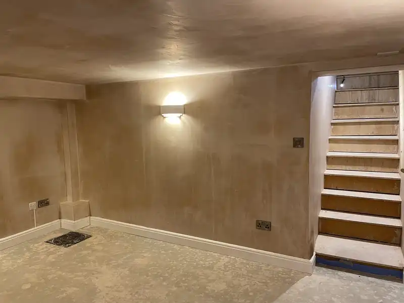 Plastered room with a staircase in a period house