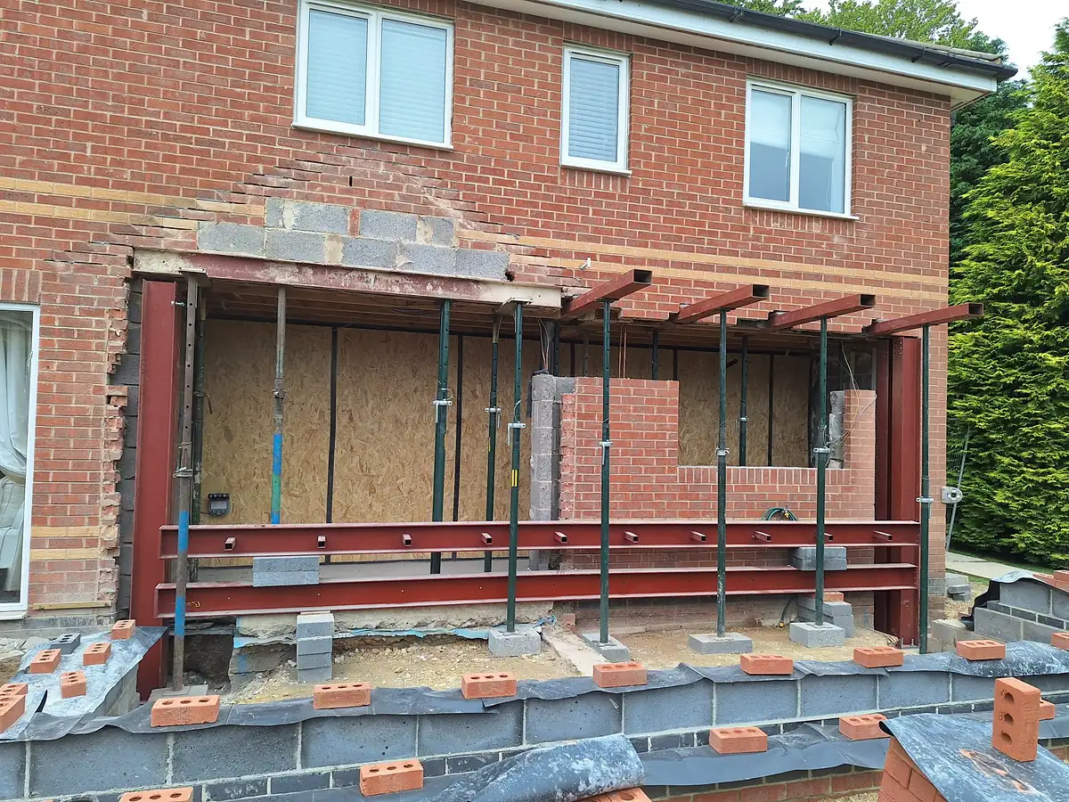 Rear of a brick house with new steels in place