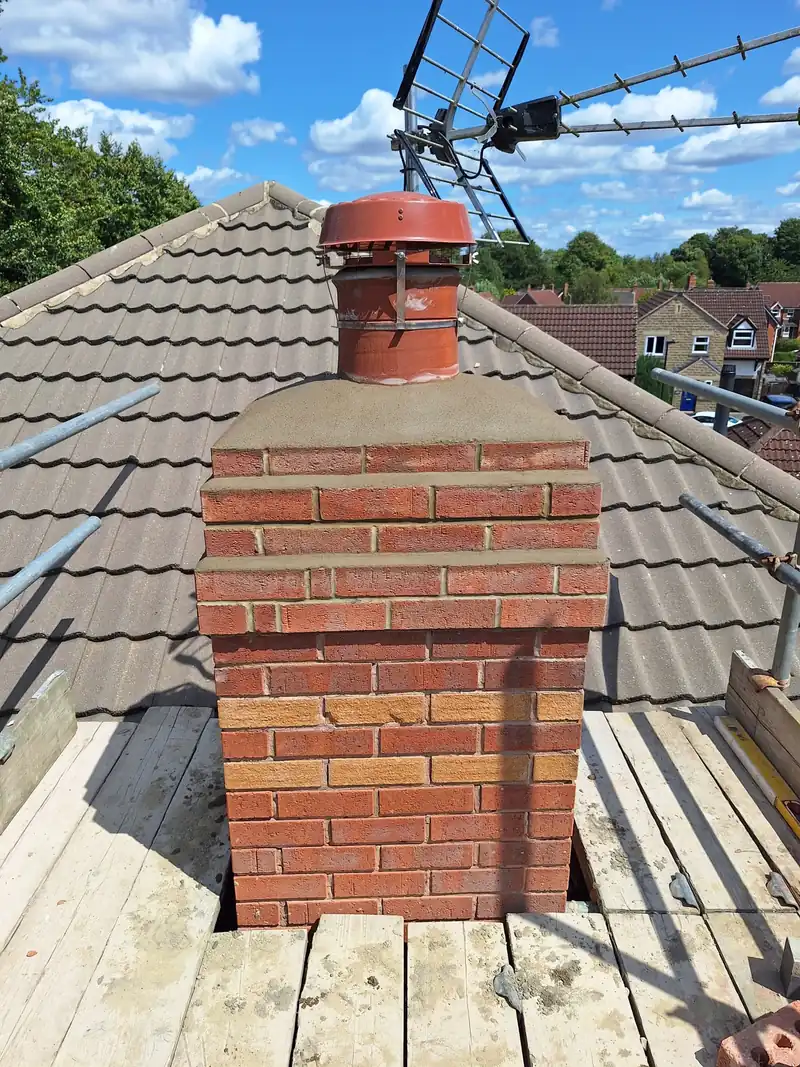 Rebuilt chimney with new pot