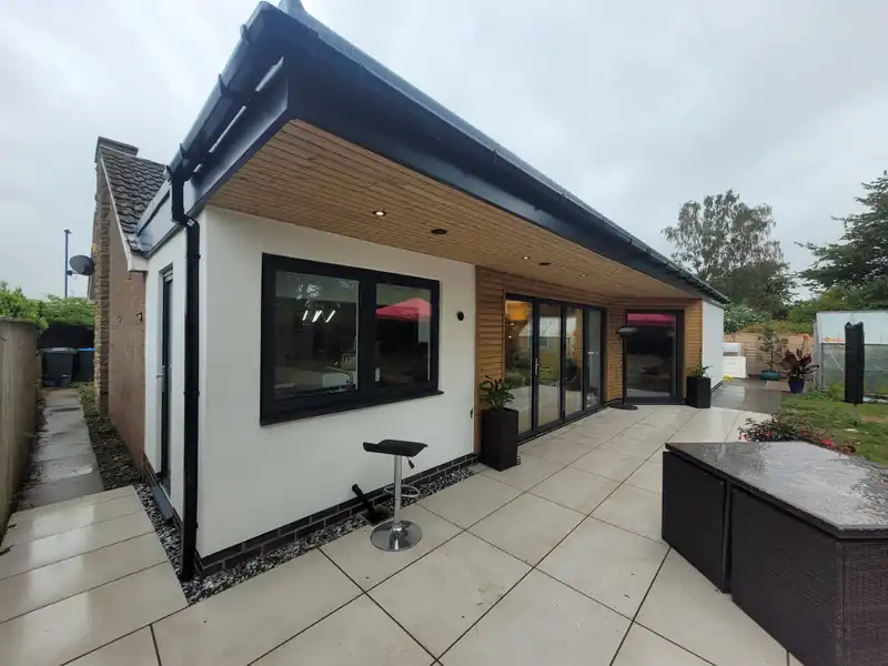 Rendered extension with a porcelain patio
