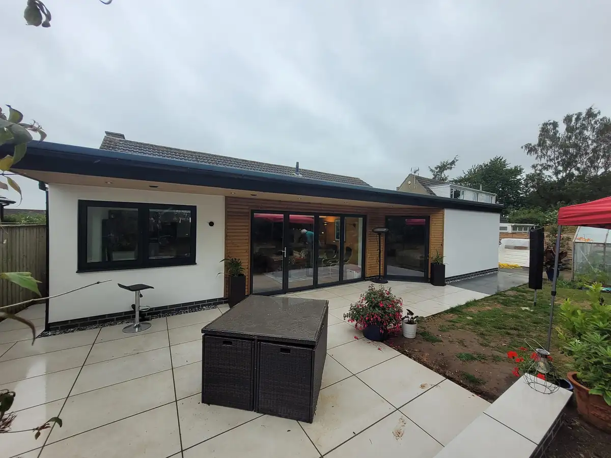 Rendered wraparound extension with porcelain patio