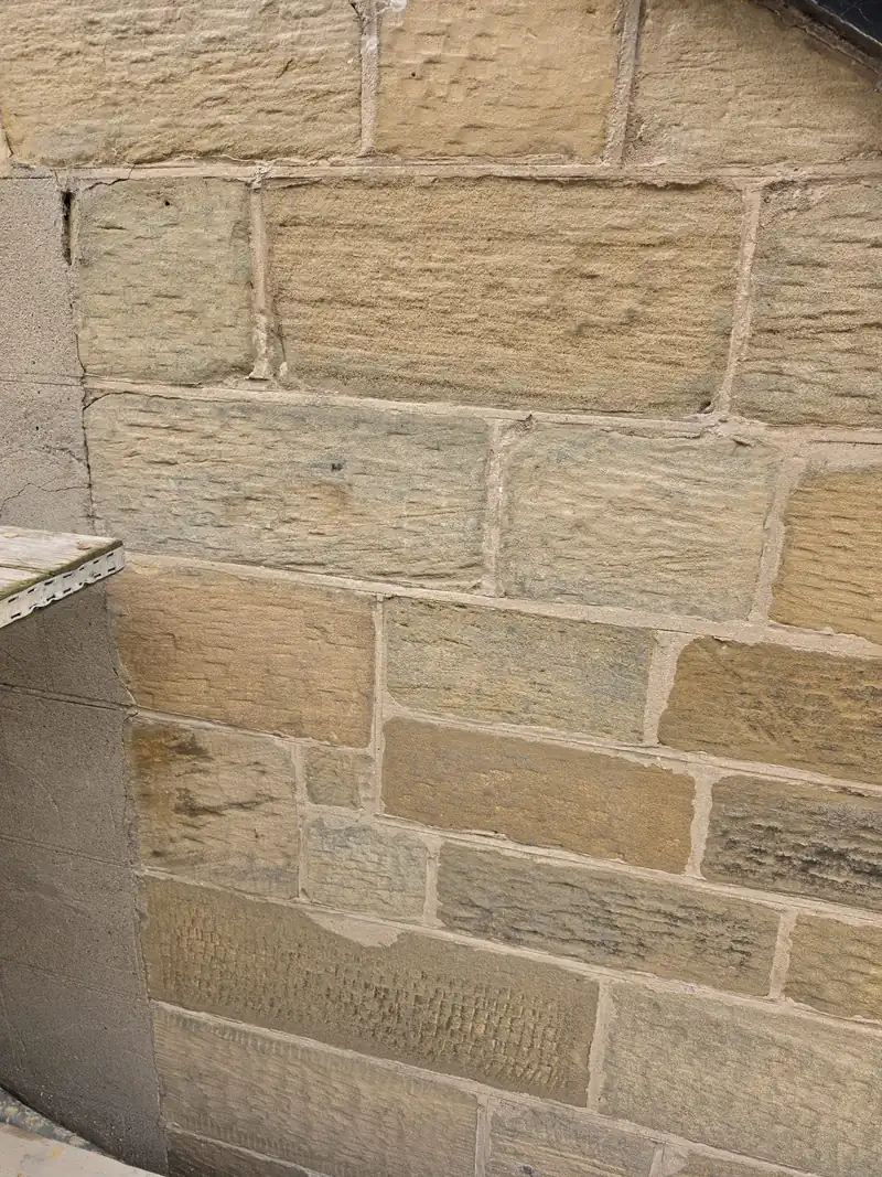 Repointed coursed sandstone