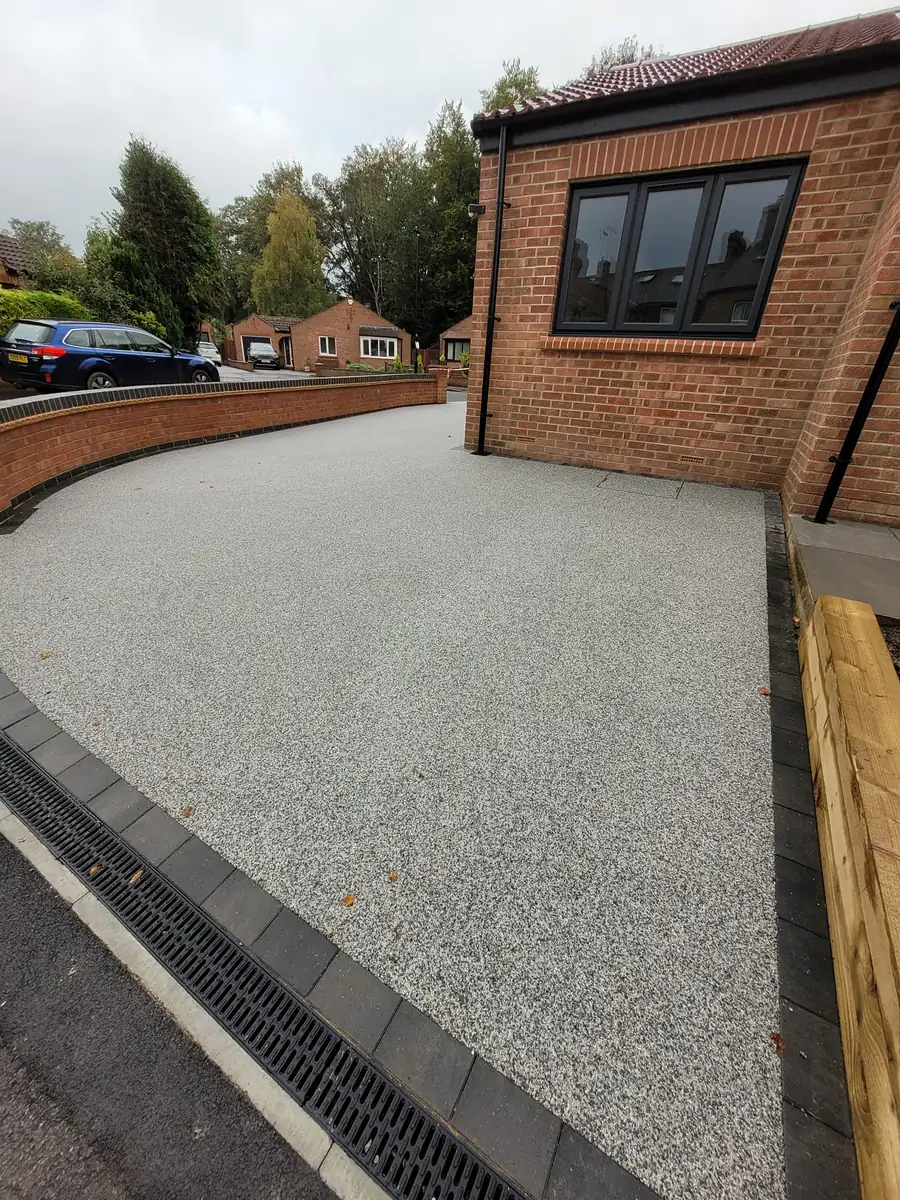 Resin driveway and brick retaining wall