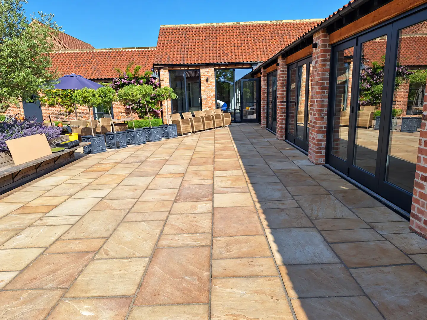 Sandstone courtyard terrace laid by Barlow Construction