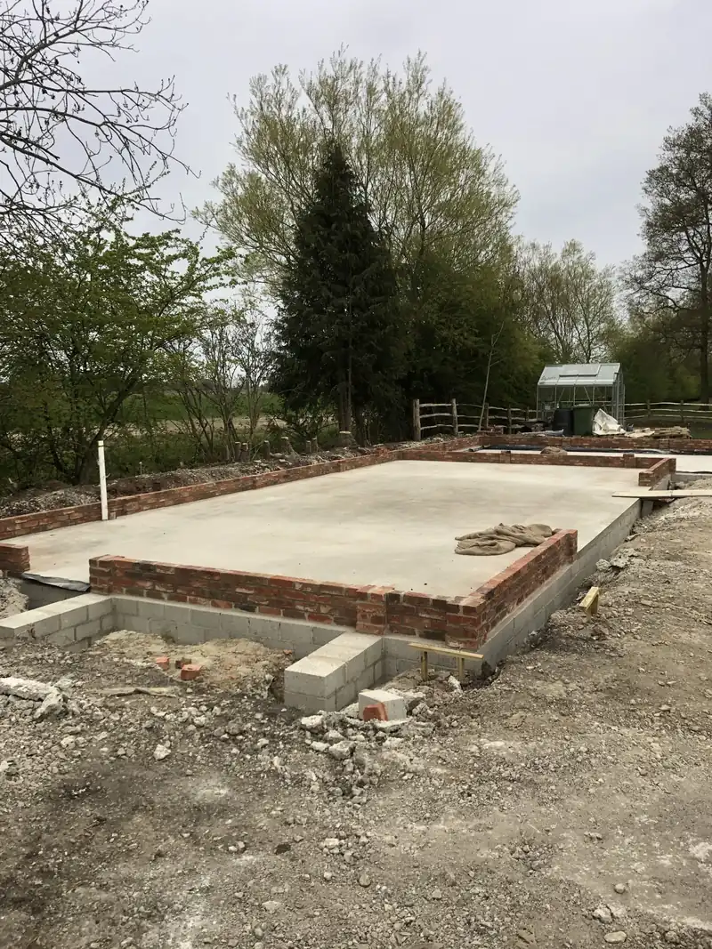 Slab for the SIP building set out in a garden