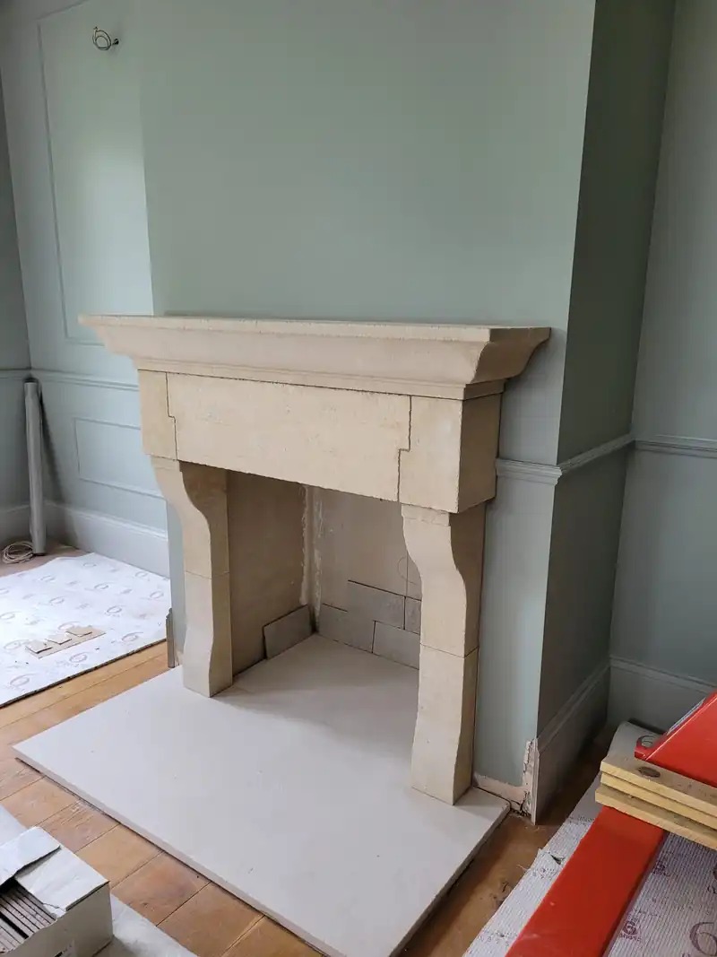 Stone fireplace in a painted room