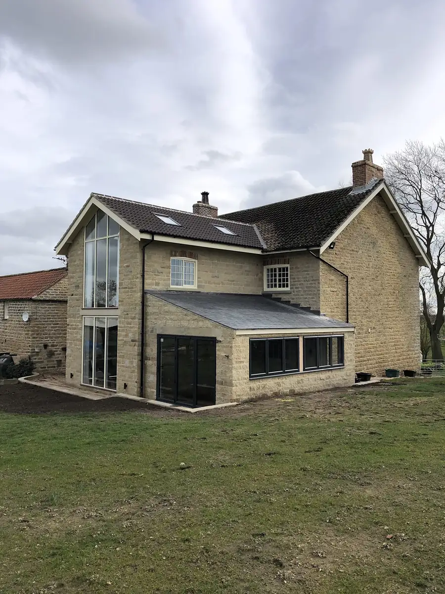 Stone house with two storey extension