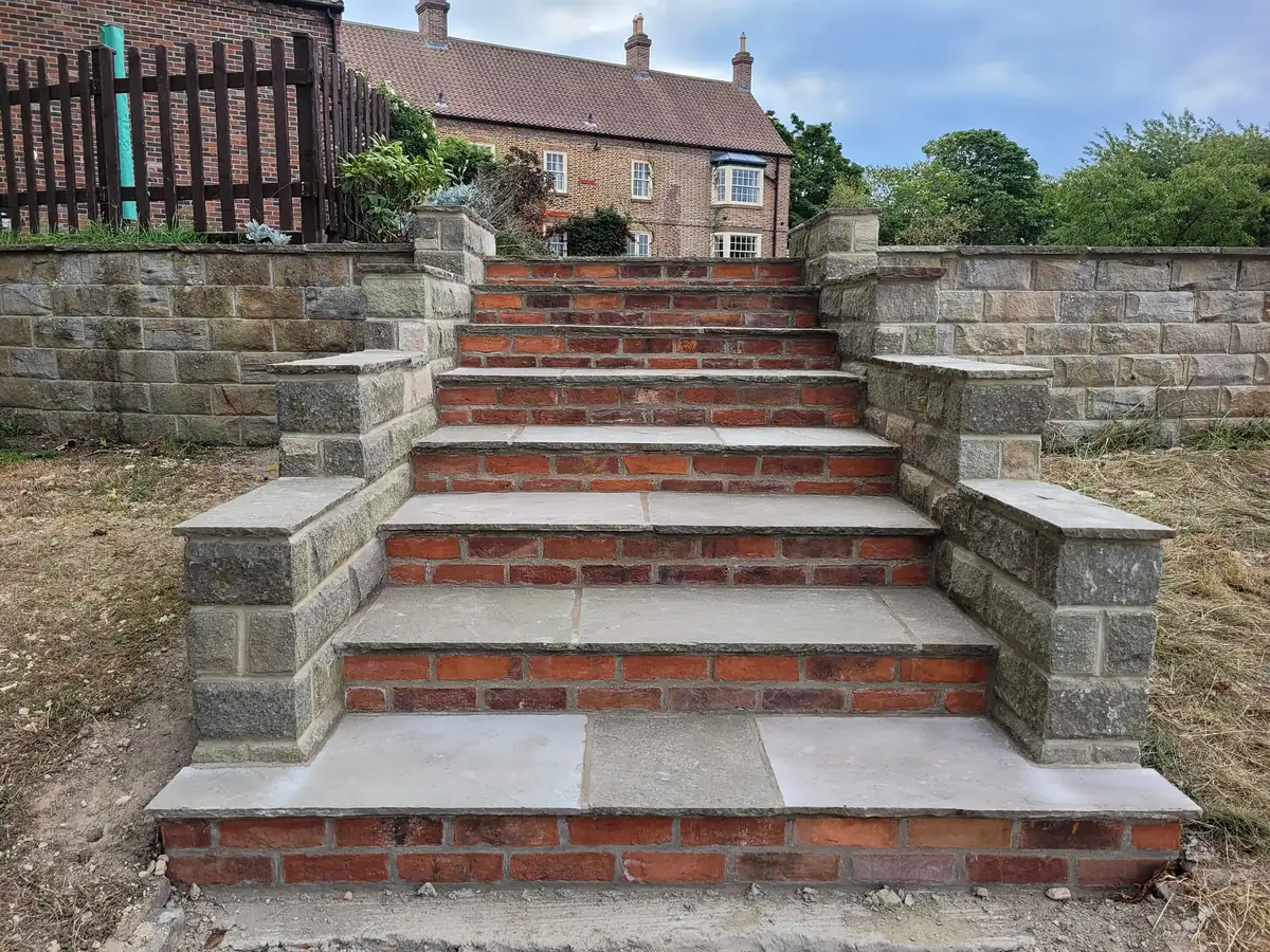 Stone steps with brick risers