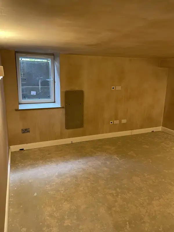 Tanked and plastered basement room