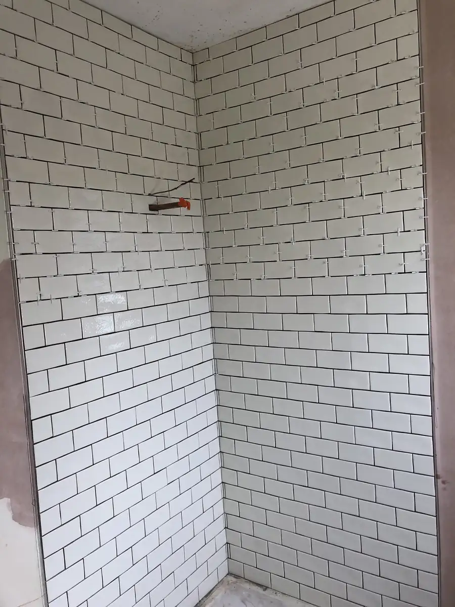 White metro tiles with dark grout